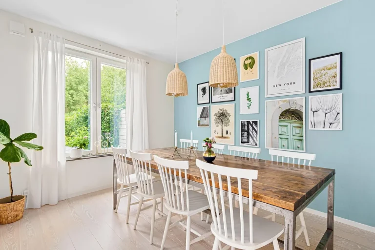 Licensed commercial painter finish in a modern dining room with fresh blue feature wall and white trim Mornington Peninsula